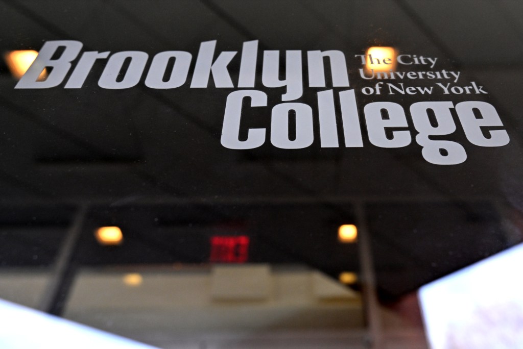 A picture of building at Brooklyn College with the school's name written in white on a black wall. 