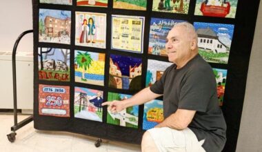 Completed community tapestries created by Riverdale residents commemorate the nation