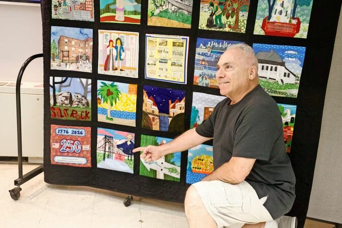 Completed community tapestries created by Riverdale residents commemorate the nation