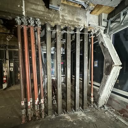 Photos show the buckling of structural columns at the Midtown building, which workers say they have been warning about.