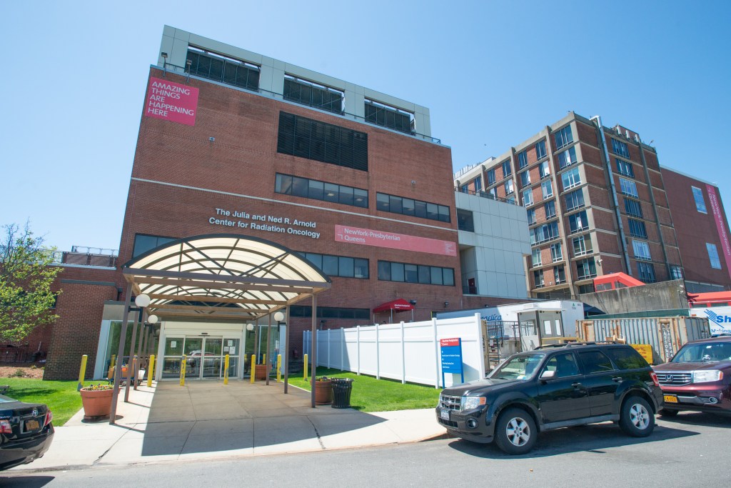 Exterior of NewYork-Presbyterian Queens, showing the Julia and Ned R. Arnold Center for Radiation Oncology entrance.