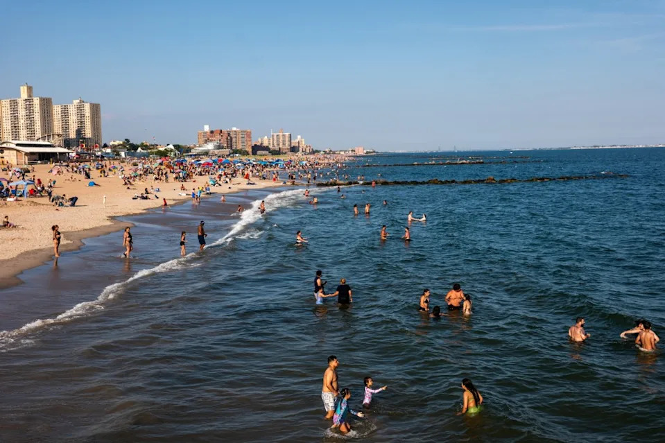 New Yorkers took to Coney Island to cool down yesterday before the heat wave. Getty Images