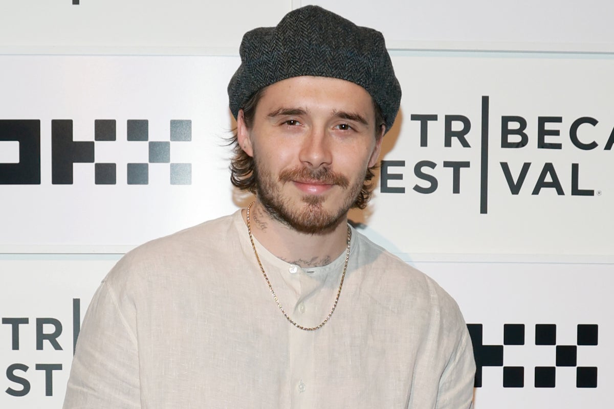 Brooklyn Beckham watches World Cup final from sofa as estranged family attends game