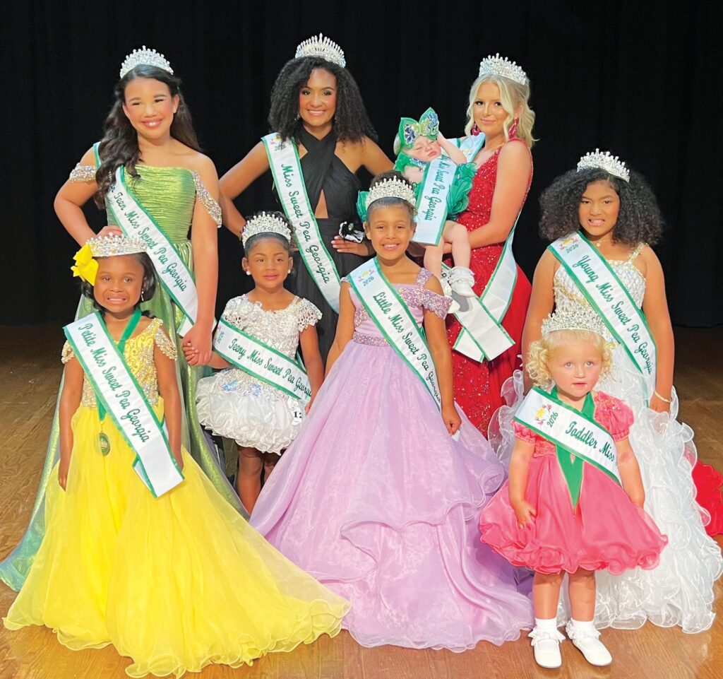 Queens, pictured L-r include Avi Knight, Petite Miss Sweet Pea; Railey Weathersby, Teen Miss Sweet Pea; McKenna Gaddy, Teeny Miss Sweet Pea; Quortney Perkins, Miss Sweet Pea 2026; Journee Myers, Little Miss Sweet Pea; Lillie Mixon, Baby Miss Sweet Pea; Jewels Myers, Junior Teen Miss Sweet Pea; Memphis Williams, Toddler Miss Sweet Pea and Faith Strobridge, Young Miss Sweet Pea.