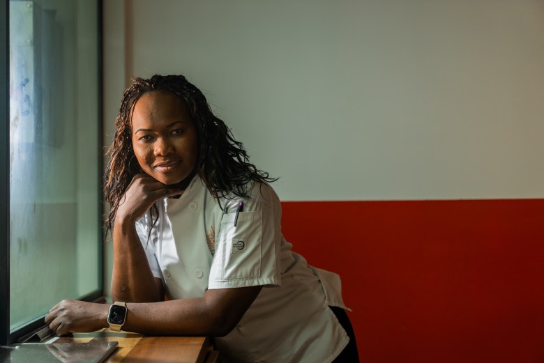 Chef Eva Volmar at the pass in La Cachette du Coin restaurant in Brooklyn on Friday, May 29, 2026. Photo by Allison Hunter for The Haitian Times. 
