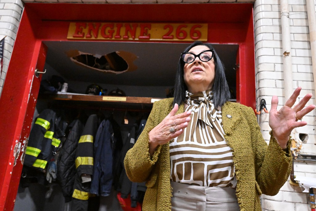 Council member Joann Ariola speaks inside FDNY firehouse.