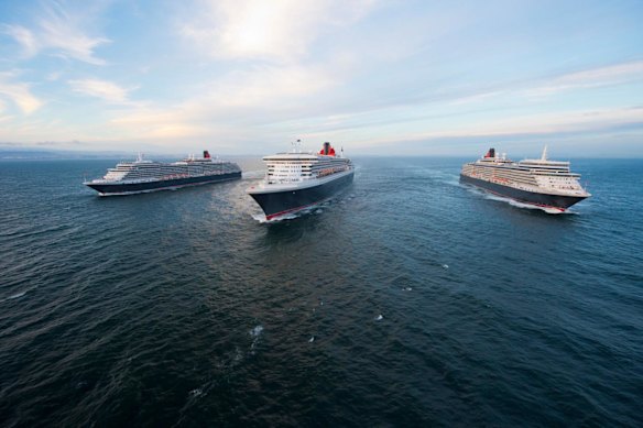 The Queen Mary 2 and sister ships Queen Elizabeth and Queen Victoria sail in formation en route to the UK in 2014.