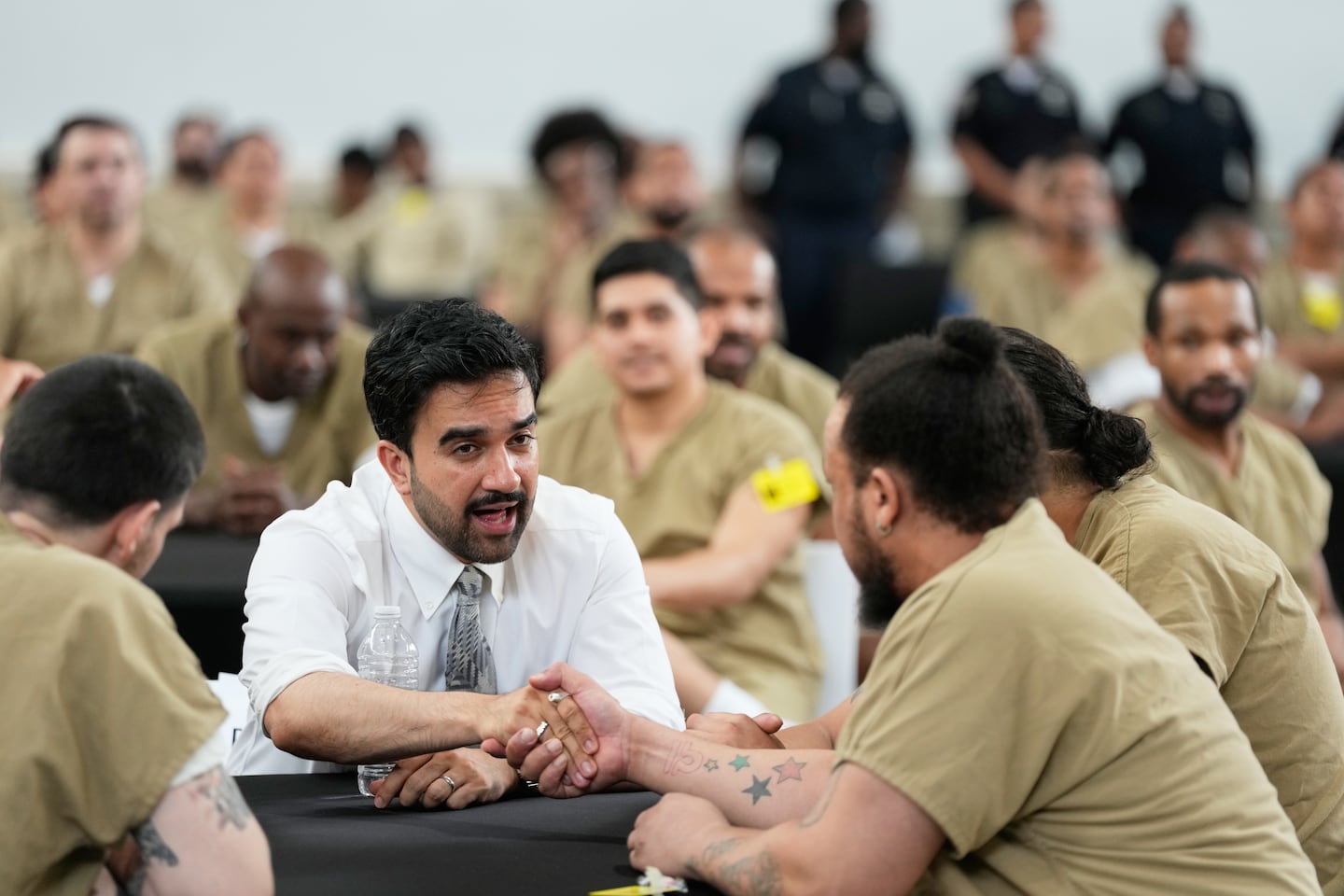 New York City Mayor Zohran Mamdani speaks with Rikers Island inmates as they watch the World Cup semifinal soccer match between England and Argentina, at the jail complex in New York.
