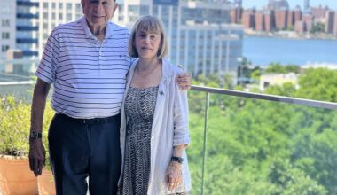 Norman Brodsky and his wife, Elaine, on the balcony of their Williamsburg office. Photo: Wayne Daren Schneiderman/Brooklyn Eagle