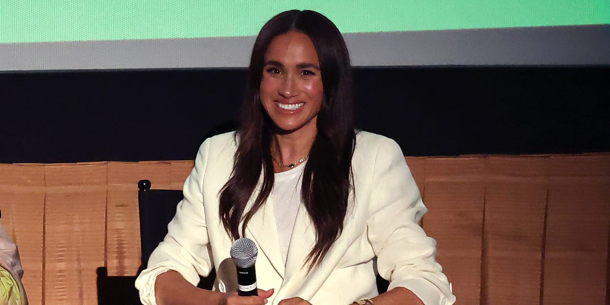 Meghan Markle Attends a Screening of ‘Cookie Queens’ in a Cream Suit Set With Hermès Sandals