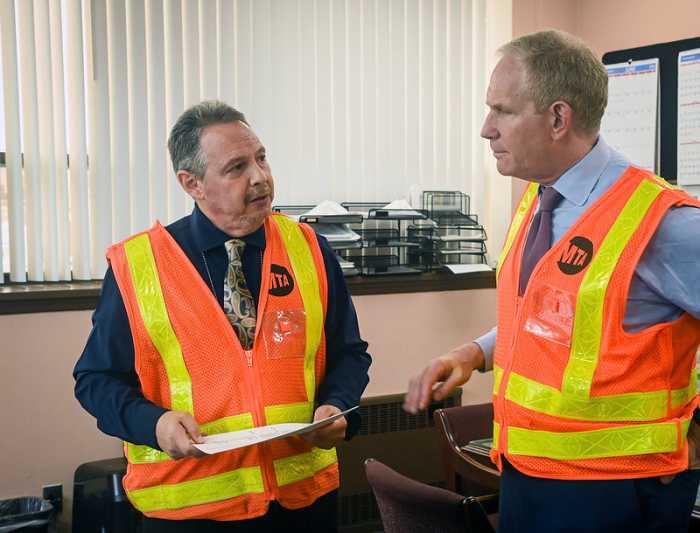 Lieber talks to Edwin Santiago, Assistant General Manager of Operations at the LaGuardia Bus Depot. Photo via MTA/Marc Hermann.