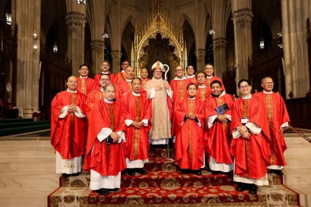 Fr. Rhey with Filipino priests during the Santacruzan. Courtesy Matthew Adam via The FilAm