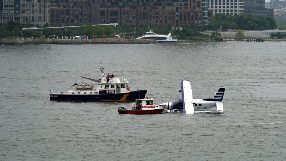 Emergency services respond to a downed seaplane in the East River on July 5 in New York. - Ryan Murphy/Getty Images