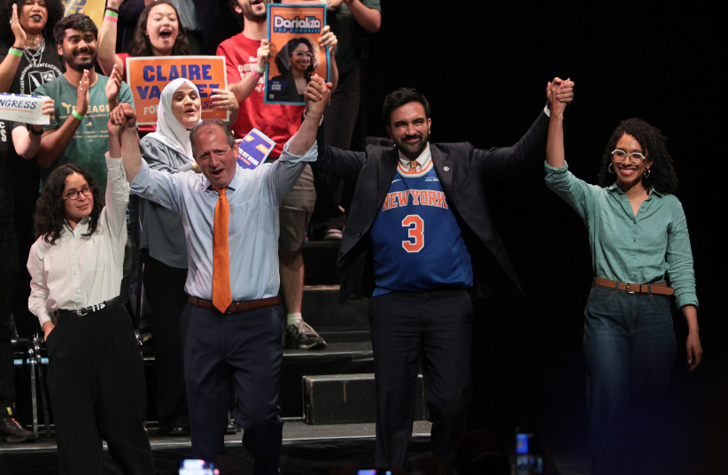 Congressional candidate Claire Valdez, Congressional candidate Brad Lander, Mayor Zohran Mamdani, and Congressional candidate Darializa Avila Chevalier raise their hands during a Get Out the Vote (GOTV) rally at King's Theater on June 18, 2026 in New York City.