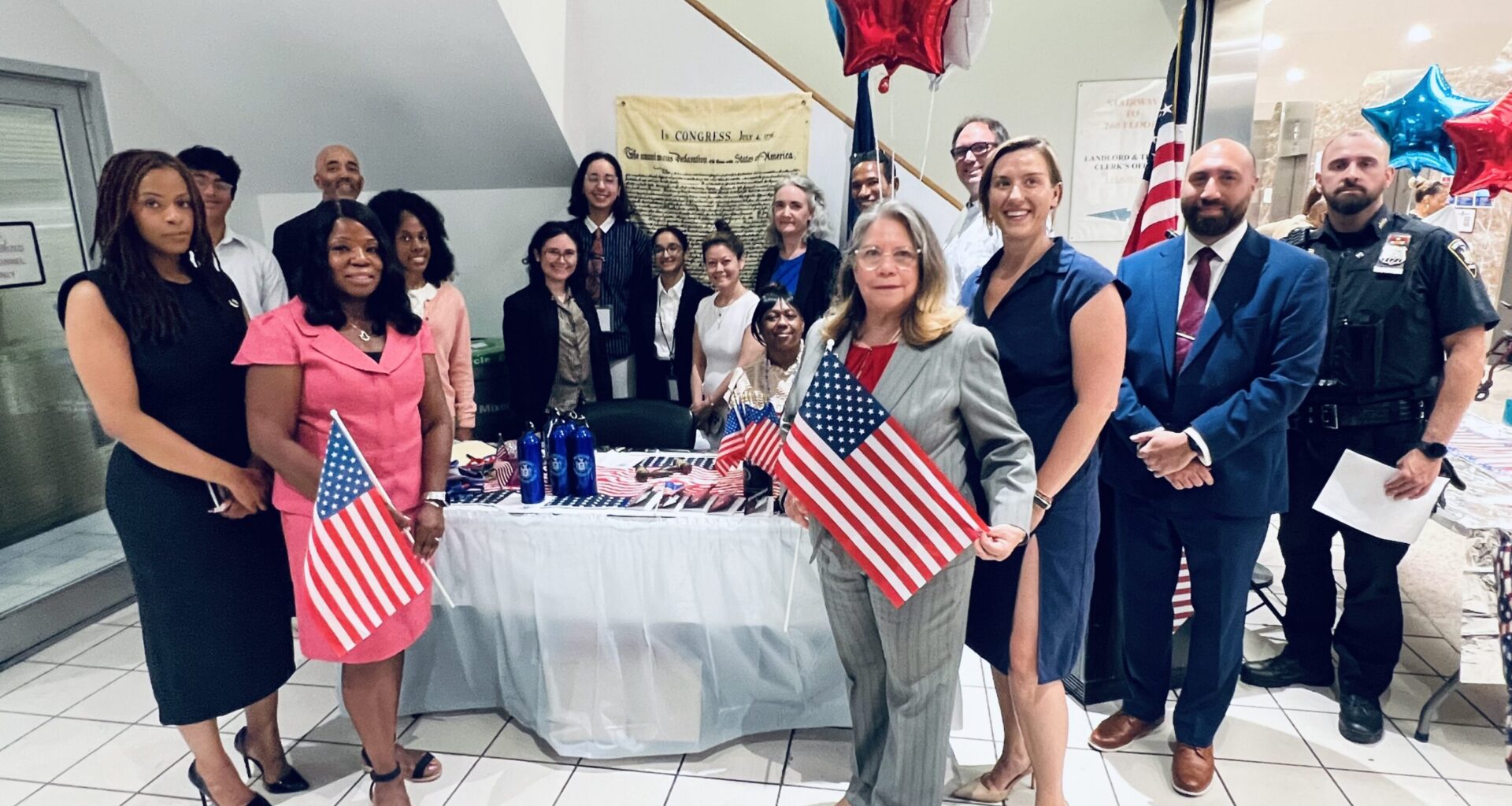 From left: Hon. Rachel Vincent, Hon. Pamela Patton Fynes, Hon. Carmen Pacheco, Hon. Alexis Riley, Borough Chief Clerk Mike Gallo and Court Officer Mark Bassner alongside participants in the Declaration of Independence reading. Photo: Wayne Daren Schneiderman/Brooklyn Eagle