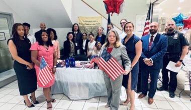 From left: Hon. Rachel Vincent, Hon. Pamela Patton Fynes, Hon. Carmen Pacheco, Hon. Alexis Riley, Borough Chief Clerk Mike Gallo and Court Officer Mark Bassner alongside participants in the Declaration of Independence reading. Photo: Wayne Daren Schneiderman/Brooklyn Eagle