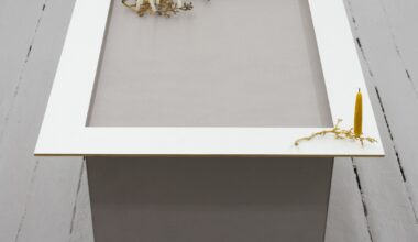 Molly Rose Lieberman, The candle is on the table, 2026. Bookboard, mdf frame, bronze, beeswax candles, 23 ½ × 27 ¼ × 23 ¼ inches. Courtesy the artist and Theta, New York.
