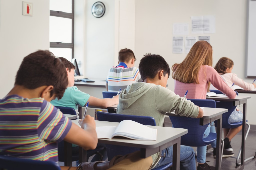 Kids working in classroom. 