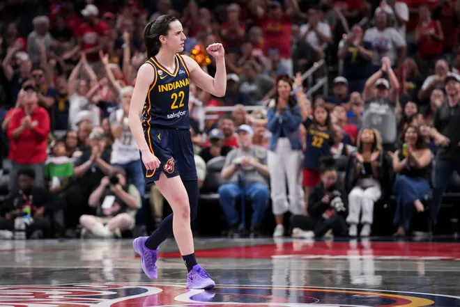 Indiana Fever guard Caitlin Clark (22) celebrates a made 3-pointer during the second half of a game at Gainbridge Fieldhouse in Indianapolis on Saturday, July 18, 2026.