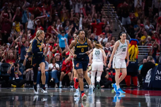 Jul 18, 2026; Indianapolis, Indiana, USA; Indiana Fever guard Kelsey Mitchell (0) celebrates a made shot in the second half against the New York Liberty at Gainbridge Fieldhouse. Mandatory Credit: Trevor Ruszkowski-Imagn Images
