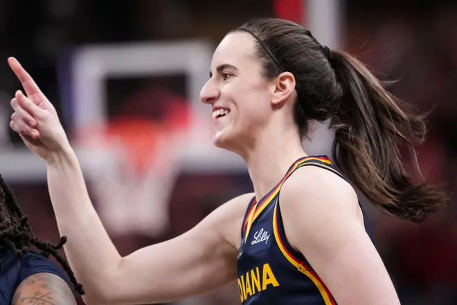 Indiana Fever guard Caitlin Clark (22) celebrates after scoring during the second half of a game at Gainbridge Fieldhouse in Indianapolis on Saturday, July 18, 2026.