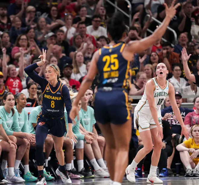 Indiana Fever guard Sophie Cunningham (8) celebrates a 3-pointer made during the first half of a game at Gainbridge Fieldhouse in Indianapolis on Saturday, July 18, 2026.