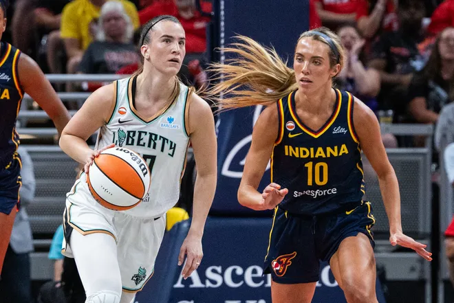 Jul 18, 2026; Indianapolis, Indiana, USA; New York Liberty guard Sabrina Ionescu (20) dribbles the ball while Indiana Fever guard Lexie Hull (10) defends in the first half at Gainbridge Fieldhouse. Mandatory Credit: Trevor Ruszkowski-Imagn Images