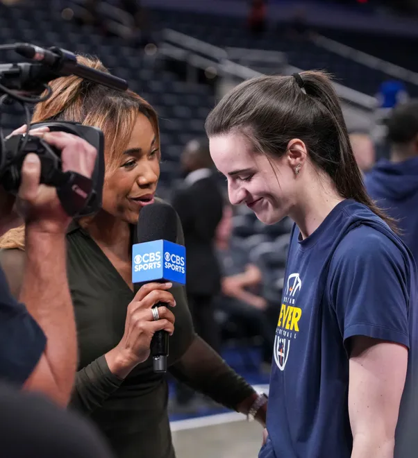 Indiana Fever guard Caitlin Clark (22) listens during an interview before a game against the New York Liberty at Gainbridge Fieldhouse in Indianapolis on Saturday, July 18, 2026.