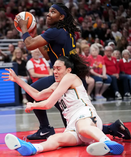 Indiana Fever forward Myisha Hines-Allen (2) grabs the ball over New York Liberty forward Breanna Stewart (30) during the second half of a game at Gainbridge Fieldhouse in Indianapolis on Saturday, July 18, 2026.