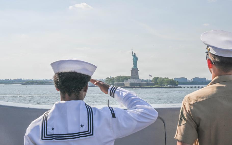 A sailor salutes Lady Liberty.