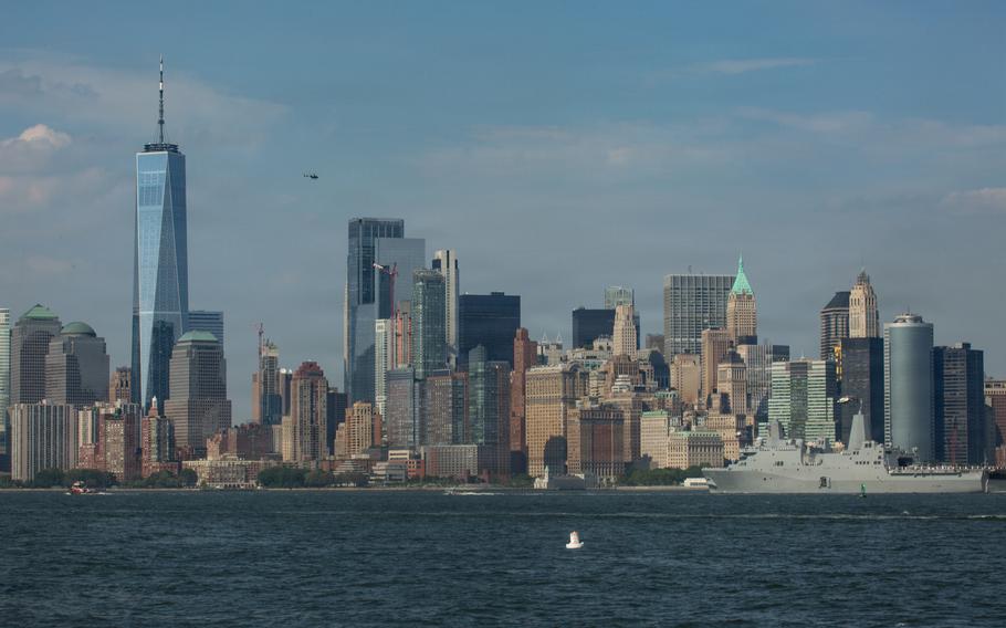 One World Trade Center and the downtown New York skyline are in the background.