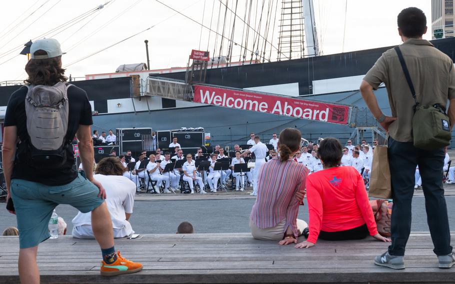 Spectators listen to the music.