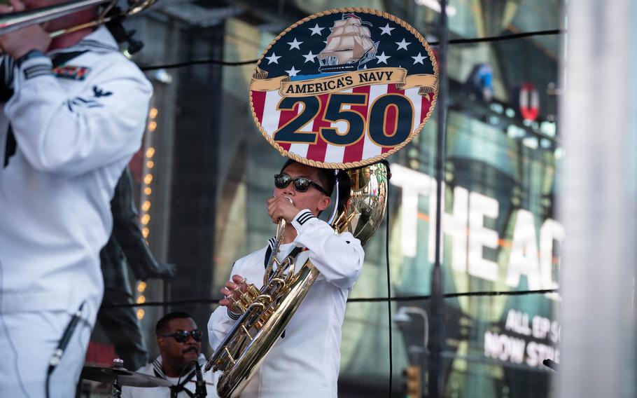 Yang plays a sousaphone ... A sign saying America’s Navy 250 covers the bell.