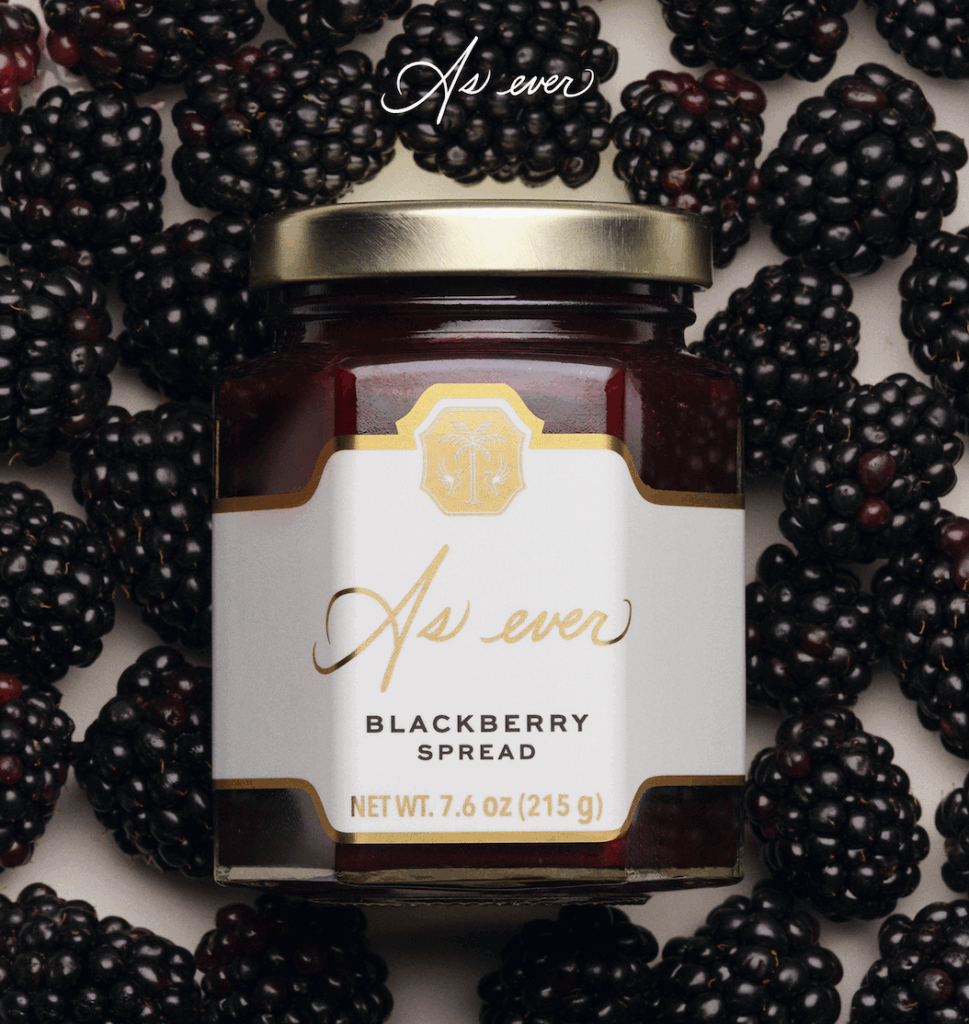 Jar of As Ever blackberry spread, surrounded by fresh blackberries and a gold-lid cap.