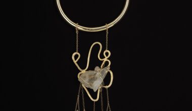 Douriean Fletcher, Necklace from the "Messengers" collection [M3], 2016 (re-created 2025). Gold-plated brass, gold-plated copper, gold-filled chain, gold-filled wire, and quartz. Courtesy the artist.