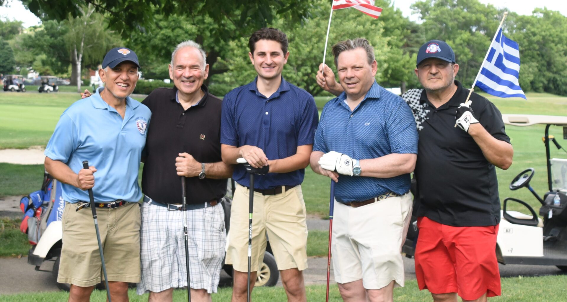 Two flags, one spirit — Ahepan brothers raise the American and Greek colors at Dyker Beach. Photo: Courtesy of AHEPA