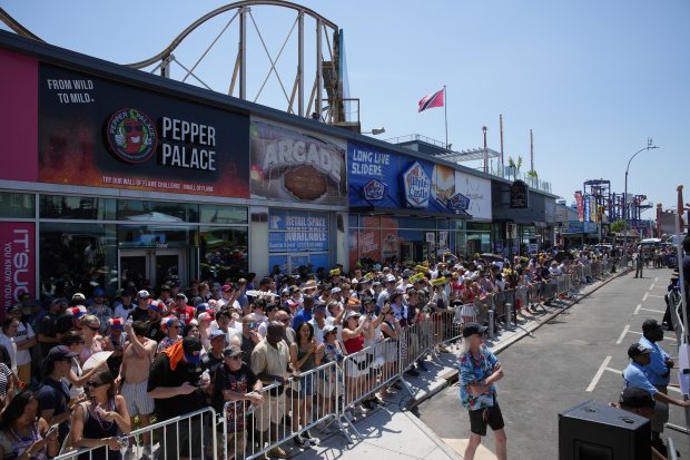 Spectators gather before the start of the 2026 Nathan's Famous Fourth of July hot dog eating contest at Coney Island in Brooklyn on Saturday, July 4, 2026. (AP Photo/Anna Connors)