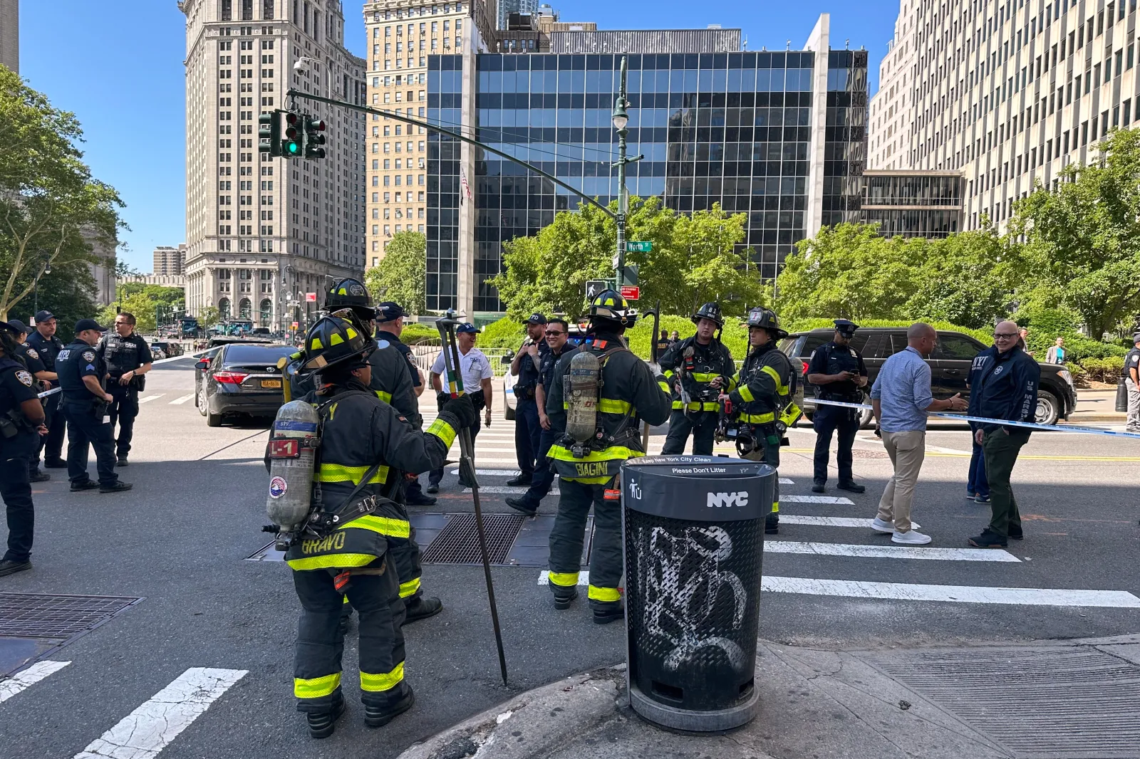 The New York City Fire Department and law enforcement respond to an incendiary device outside the New York federal building in lower Manhattan, Monday, July 20, 2026, in New York. (AP Photo/Larry Neumeister)