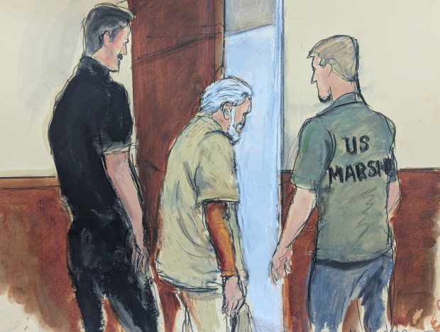 In this courtroom sketch Ismael "El Mayo" Zambada, center, is escorted by U.S. Marshals out of federal court after his sentencing in the Brooklyn borough of New York, Monday, July 20, 2026. (Elizabeth Williams via AP)