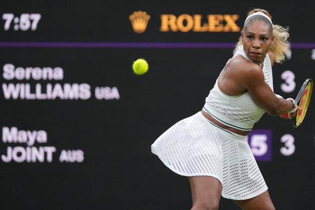 Serena Williams of the plays a backhand against Maya Joint.