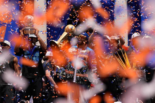 Karl-Anthony Towns celebrates with teammates during the Knicks' championship parade.