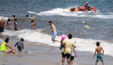 Lifeguards ride a jet ski during a shark patrol run at Jones Beach State Park, Thursday, July 6, 2023, in Wantagh, N.Y.