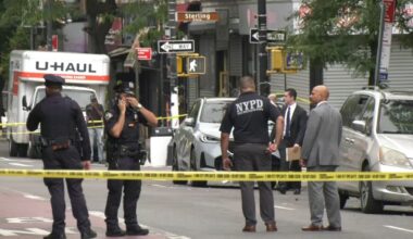 NYPD near police tape in Brooklyn