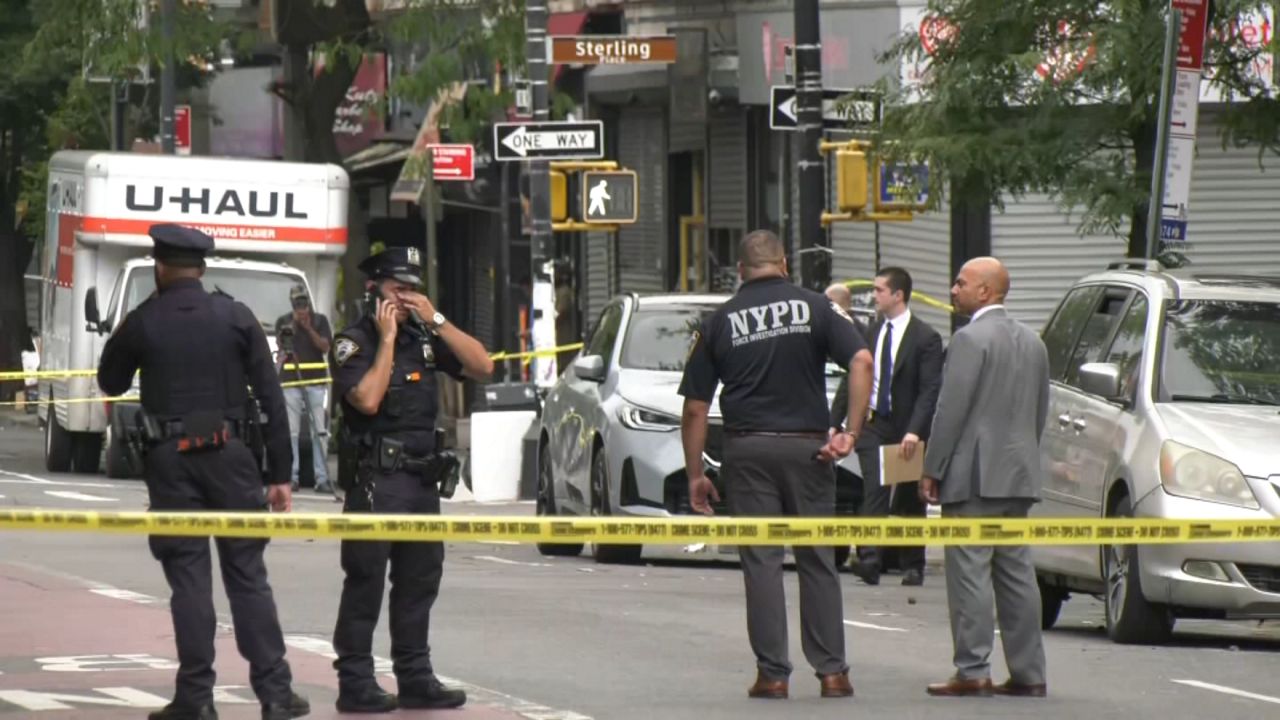 NYPD near police tape in Brooklyn