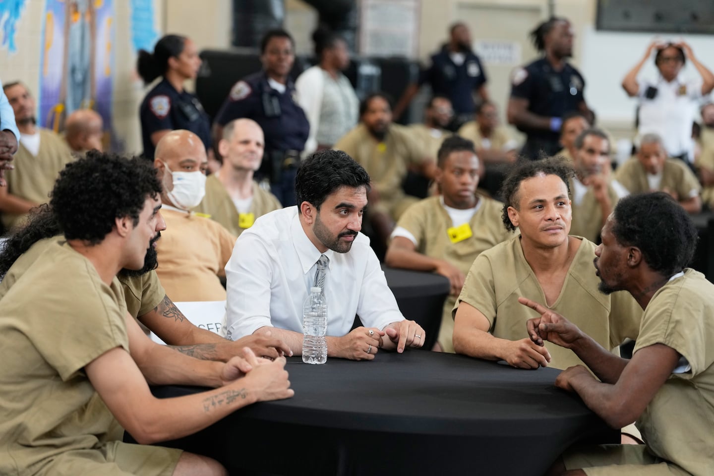 New York City Mayor Zohran Mamdani speaks with Rikers Island inmates as they watch the World Cup semifinal soccer match between England and Argentina, at the jail complex in New York.