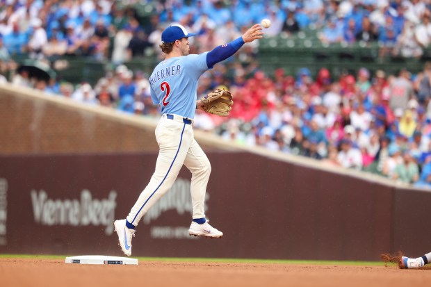 Cubs second baseman Nico Hoerner throws to first on a double play in the top of the sixth inning against the Yankees on Friday, July 31, 2026, at Wrigley Field. (Stacey Wescott/Chicago Tribune)
