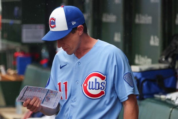 Cubs manager Craig Counsell looks at his notes in the top of the eighth inning during a game against the Yankees on Friday, July 31, 2026, at Wrigley Field. (Stacey Wescott/Chicago Tribune)