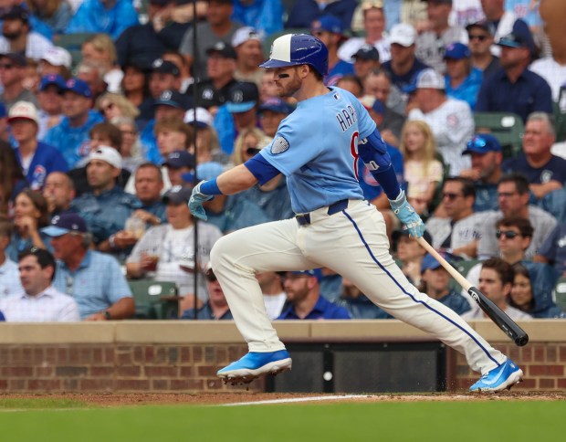 Cubs left fielder Ian Happ hits a single in the bottom of the seventh inning against the Yankees on Friday, July 31, 2026, at Wrigley Field. (Stacey Wescott/Chicago Tribune)
