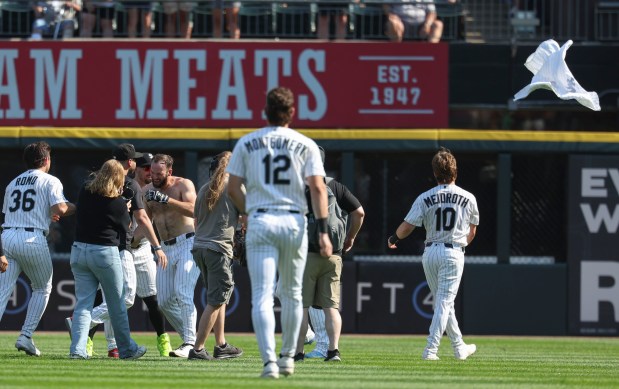 Chicago White Sox center fielder Tristan Peters loses his jersey celebrating with teammates after taking a walk-off walk to defeat the New York Yankees 2-1 in 11 innings Thursday, July 30, 2026, at Rate Field. (Brian Cassella/Chicago Tribune)
