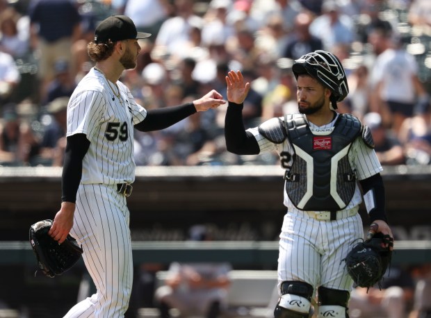 Chicago White Sox pitcher Sean Burke and catcher Edgar Quero celebrate getting through the fourth inning against the New York Yankees on Thursday, July 30, 2026, at Rate Field. (Brian Cassella/Chicago Tribune)